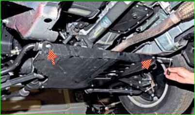 Removing oil pan guard and engine mudguard