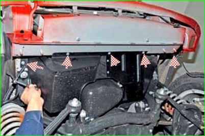 Removing the oil pan guard and engine splash guard